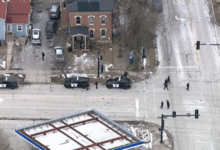 Crime scene tape secures the area after an officer-involved shooting in Aurora.