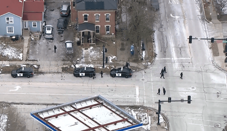 Crime scene tape secures the area after an officer-involved shooting in Aurora.