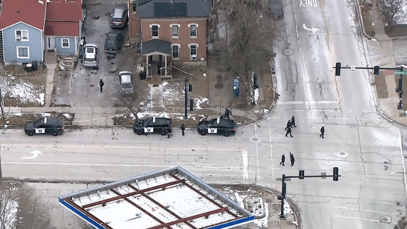 Crime scene tape secures the area after an officer-involved shooting in Aurora.