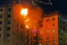 Smoke rising from the 15th and 16th floors after the gas explosion.