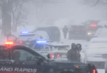 Grand Rapids Police cruiser responding to the triple shooting on Worden Street SE.