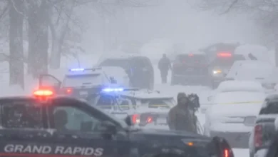 Grand Rapids Police cruiser responding to the triple shooting on Worden Street SE.