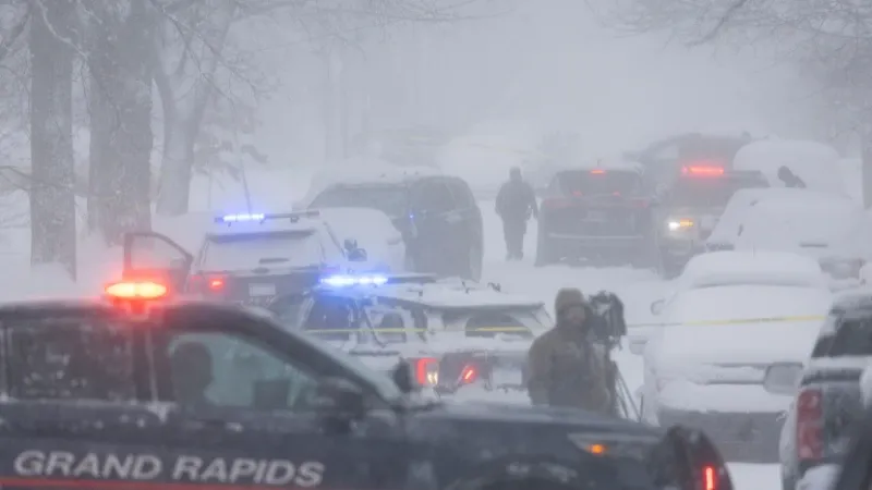 Grand Rapids Police cruiser responding to the triple shooting on Worden Street SE.