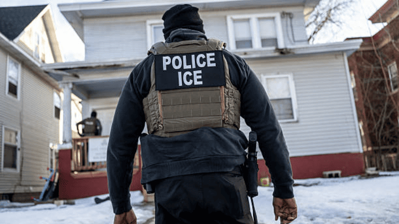 Federal agents executing an operation linked to ICE warrantless home entry policy.