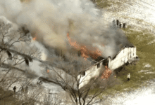 Intense flames from a suburban Chicago church fire engulfing the roof.