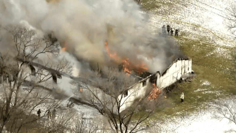 Intense flames from a suburban Chicago church fire engulfing the roof.
