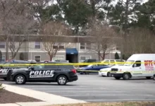 Ambulance responding to the scene where an infant and man were shot.