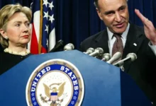 Bill and Hillary Clinton standing together at a public event.