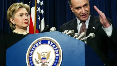 Bill and Hillary Clinton standing together at a public event.