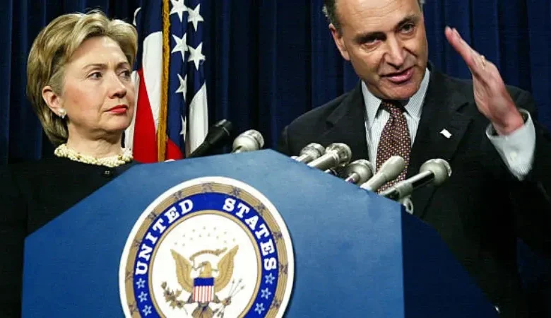 Bill and Hillary Clinton standing together at a public event.