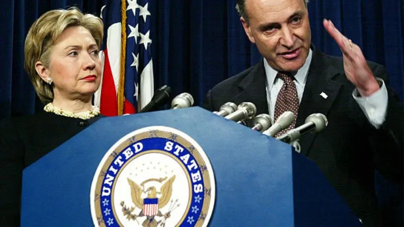 Bill and Hillary Clinton standing together at a public event.