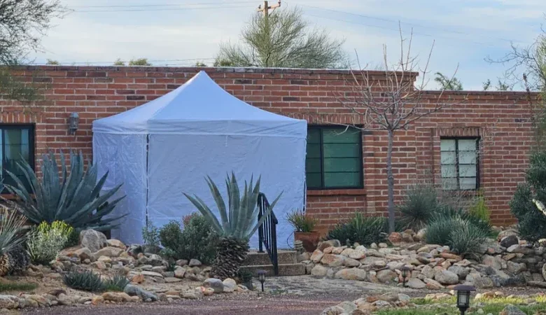 A white forensic tent erected at the Nancy Guthrie home during the abduction investigation.