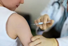 A healthcare worker administering a flu vaccine to a young child.