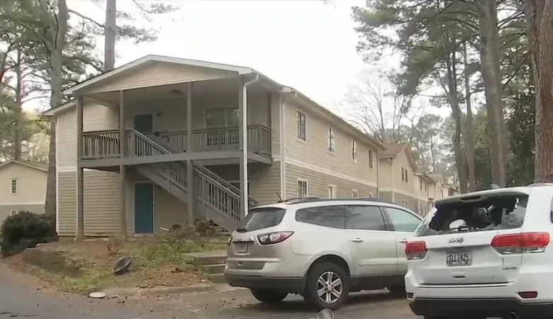 Atlanta police secure the residential perimeter following a tragic Atlanta fatal stabbing.