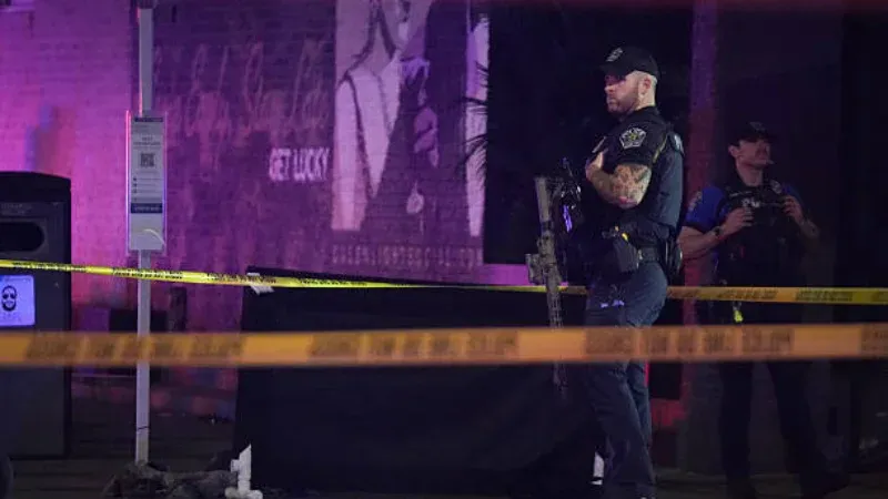 Law enforcement secures the scene of the fatal Estabrook Park shooting in Shorewood.