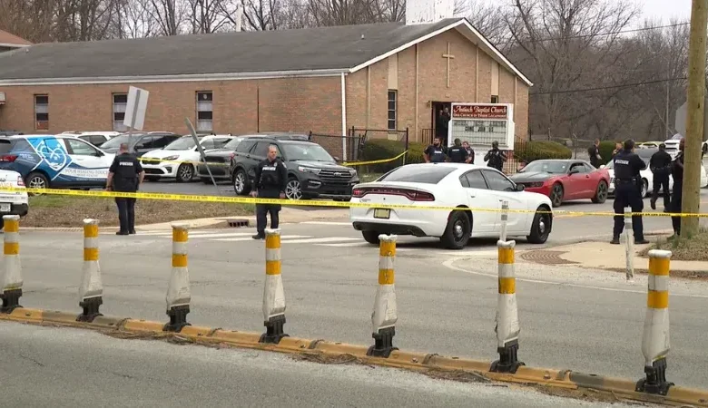 Detectives investigate the street after a deadly Indianapolis church shooting.