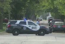 Law enforcement officers secure the perimeter following a brutal Joliet teen shooting at West Park.