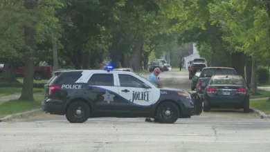 Law enforcement officers secure the perimeter following a brutal Joliet teen shooting at West Park.