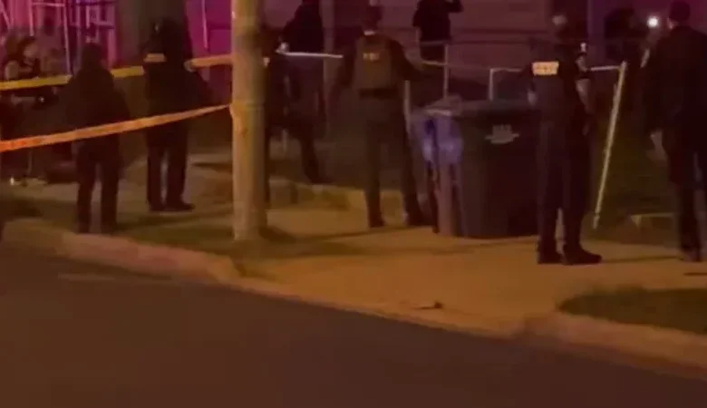 Neighbors gather outside following the violent incident where a US Park Police officer shot in Southeast DC