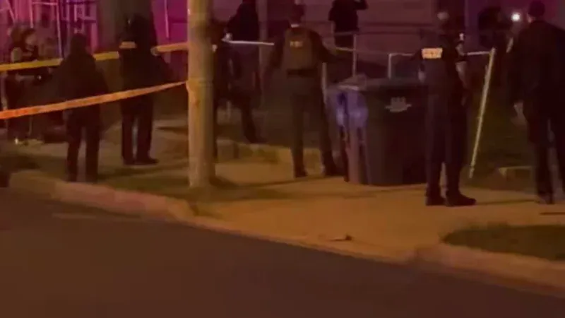 Neighbors gather outside following the violent incident where a US Park Police officer shot in Southeast DC