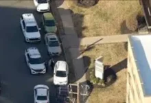Law enforcement officers block off the crime scene during the recent Rhawnhurst fatal shooting investigation.