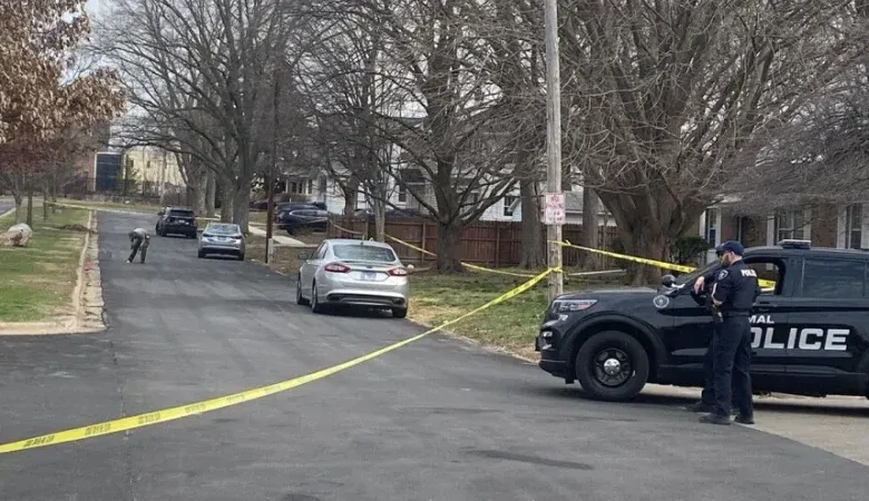 Crime scene tape securing the perimeter after a Normal off-campus shooting.