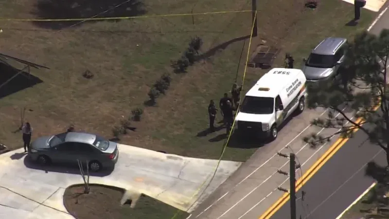 Detectives secured a shallow backyard grave during the Palm Coast infant death investigation.