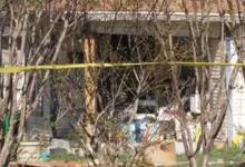 Stephenville Texas car crash scene at a residential home at night showing police tape and emergency lights
