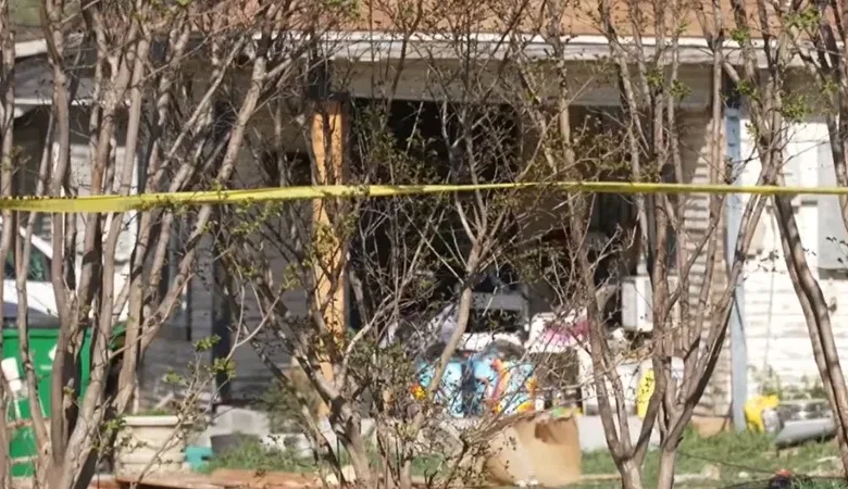 Stephenville Texas car crash scene at a residential home at night showing police tape and emergency lights