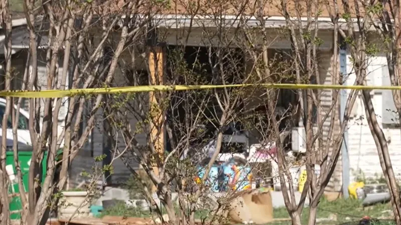 Stephenville Texas car crash scene at a residential home at night showing police tape and emergency lights