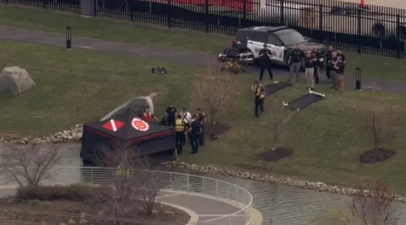 Police and emergency crews investigate body found in pond in Elk Grove Village Illinois
