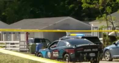 Atlanta Police Department vehicles parked on Lathrop Street SE during a death investigation.