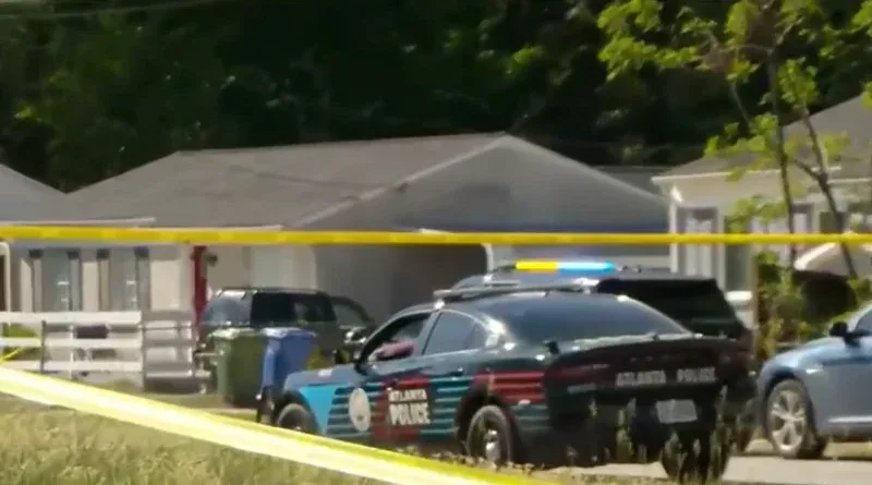 Atlanta Police Department vehicles parked on Lathrop Street SE during a death investigation.